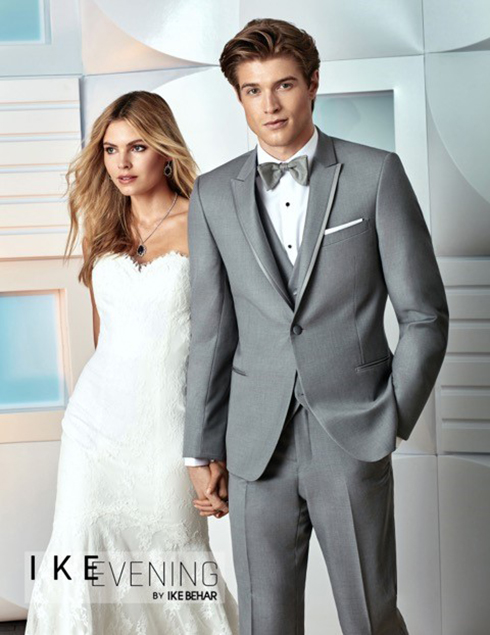 Groom in Grey Tuxedo holding hands  with Bride in Gown,  Foresto Tuxedo, Mineola.